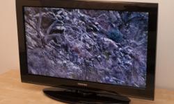 TV with shelves black in color great working condition, moving out of state must sell
