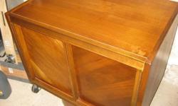 These beautiful cabinets are part of a magnificent bedroom set from the 1970s. Features simple lines and curved base. Would look great in the bedroom or living room as end tables. Well made and in excellent condition. Made in Canada of walnut wood. No