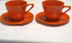 2 sets of vintage tangerine Harlequin cups and saucers, small chip in rim of one cup