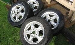 FOR SALE: 4 Aluminum Mag Rims w/ 4 Nice matcing tires, that are almost new. These are 14" wheels & tires, with 8 lug holes that will fit different lug patterns, and will fit most small cars that require a 14" wheel. Tires are: 195/60R14....This is a nice