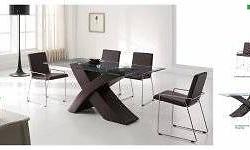 This modern set is all about style and class. Round glass top table sits on a stainless finish base. Four black chairs complete this set.
5 Piece set includes a table and 4 side chairs.
Dimensions:
Dining Chair: 19"W x 24"D x 35"H
Dining Table: 53"W x