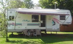 1999 Damon Challenger 5th Wheel Camper. 29 foot, Super Slide, Big windows, hard wood floor in kitchen, awning, furnace, central air conditioning, Hide away bed couch (NOT the uncomfortable sissor couch), kitchen table with 4 chairs, queen size bed, 10