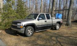 99 Chevy Silverado LS 1500 extracab with 3rd door. The truck has the 4.8 motor, great on gas, auto trans, 4x4, shortbed, z71 offroad package, tow package,daytime running lights. it's pewter (tan) and black outside, with grey cloth interior. front bucket