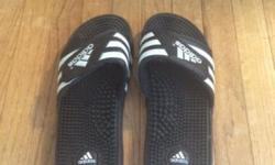 Adidas adissage Slides. Black. Never worn. Men's size 8. Women's size 9.