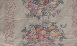 This vintage linen tablecloth is from the 1940s and 1950s, has never been used, and has the original tags on it.
It is a Charleston, made by Wilendur, white and strawberry tablecloth, measures 50 by 68 inches, and sells for $62.
Also available are other