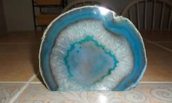 Agate Blue/Green with a Crystal Center Natural Banded Quartz Geode. This absolutely stunning specimen is the result of millions of years of crystal growth in an air pocket that formed in a volcanic lava flow in Brazil. Agate being an eight on the hardness