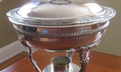 Aluminum Chafing Warming Dish with Pyrex Casserole. Flower wreath knob, intricate stand and claw feet add charm and interest. In great condition with minimal wear or scratching. Measures: 11" tall, and 9" diameter.
Cash or PayPal accepted. Delivery