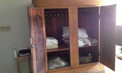 American Pine closet pre 1900 purchased in late 80?s in Brooklyn on Atlantic Avenue. The closet comes totally apart, roughly 10 pieces and can therefore be moved relatively easily. I have used it as bedroom closet, living room TV armoire both in a