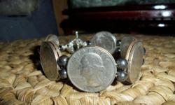 American Washington Quarters Coins Bracelet are from the 60?s,70?s and 80?s. Authentic and Dates in Front of Bracelet are 1968-P,1969-P, 1974-P, 1980-P, 1982-P and 1985-P. The coins are very nice and dates are very clear. The Front of the Bracelet starts