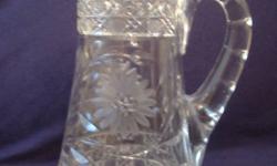 This is a gorgeous antique circa 1920s American brilliant cut crystal pitcher water jug that can be used for an arrangement of flowers or left on its own.The pictures do not do it justice! It is in immaculate condition! Just like new! This is a