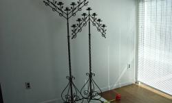 2 beautiful antique wrought iron candelabras for sale. They can be adjusted for height and stand 60 inches at their lowest height and 98 inches at their tallest. Fee free to ask any questions. $700 or your best offer