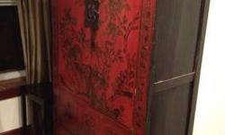 Gorgeous dark red armoire with amazing gold Chinese pattern. Approx 46" wide with two small drawers inside. Two drawers on the bottom. Great for storage.