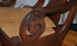 Beautiful and Comfortable Antique Dark Mahogany Scroll Armed Rush Seat Rocking Chair
Personally owned two generations.
Located in Rhinebeck, New York.
Come see and sit in the rocker.
