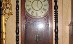This is an antique pendulum chiming wall clock. It is in relative good original condition for it's age and displays some aging of the lacquer or varnish finish. Winds up with both coils and chimes on the hour and pendulum clicked the mechanism was only