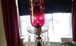 very pretty glass lamp- rose color- 20 inches tall. please call 845-679-4291