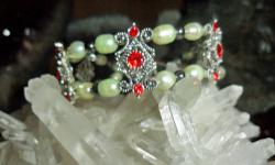 Beautiful handmade Antique Silver Color design Bracelet with Red Swarovski Crystal, Light Green Fresh Water Pearls, Black Hematite Beads and Silver loop lock. One of a kind Bracelet and Perfect with Perfection. In real time the Bracelet is just Gorgeous.