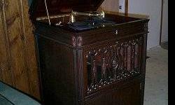 No electricity needed for this beautiful floor model crank Silvertone phonograph in very good condition, circa 1920s, original cabinet finish w/carved accents!
Purchased many years ago at an estate sale, plays perfectly! Speed and volume adjustments,