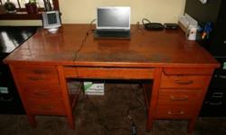 Solid Oak Desk for Sale. We have owned if for over 40 years. We bought it from a railway company when they were going out of business. It is quite possibley an antique. We are not sure of its exact age but estimate it to be 75-90 years old.
It is a large
