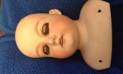 Beautiful rocker sleep eyes complete - lovely details - blue eyes in head eye lashes full and untouched - full upper teeth - very old repair in right eye socket - crack in left shoulder - you are buying the complete head as pictured but the price set is