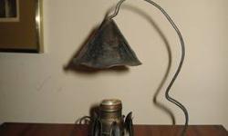 Charming little lamp 11" tall. Perfect for a night stand table, a child's room. I believe it to be old. It is in working order, but i don't have a low wattage bulb in a candle shape, which i think would be the best. The metal to me looks like copper