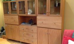 Attractive storage unit made of Narra wood with closed cabinets, drawers, glass shelves and interior lighting. Custom built with Manhattan apartment in mind. Easy assembly.
Buyer is responsible for picking up wall unit. Cash only please.