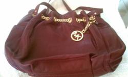 For sale new, with tag, never been used authentic Micheal Kors shoulder bag. Bordeaux colored pebbled soft leather light weight bag. Gold chain gathered around the top with MK gold emblem at the botton.
Two end slip pockets for quick access items...Double