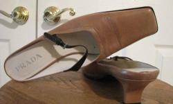Authentic PRADA Mules. Upper is in perfect condition with little wear on soles. RETAIL for over $650.00!
Color: Body Camel (Light brown) with dark brown strap
Material: Leather with patent leather strap
Size: 39 Italy (EUR) - US 8.5
Measurements:
Heels: