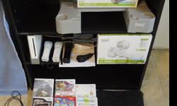 Most components like new. Some never used. Comes with: original Wii game console, sensor bar, wires/cables, balance board (with silicone cover and lifts), 2 original (classic Nintendo) controllers (barely used), 3 standard Wii controllers, 2 nunchuck
