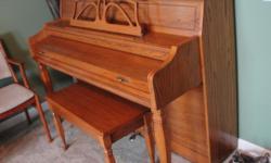 Baldwin Oak Piano & original Storage Bench. Model #655. Original owner. Purchased in January 1993. Measures 41" high, 57" wide and 24" deep. Super condition. Has one small spot on top where clear coating has come off. About the size of a quarter.