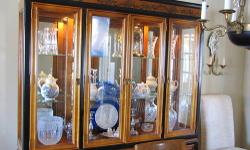 Bassett Glass and Mirror Wood china cabinet. Top display glass/morror and wood case is separate for easier moving. Bottom wood base has two side doors with interior shelves and three center drawers for storage. Brass fittings and interior display case