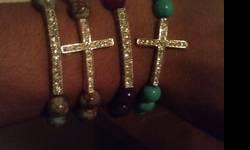 This posting is four 4 handmade beaded bracelets. 2 with a rhinestone bar and 2 with a rhinestone cross. 10.00 each bracelet or 35 for all. Only serious inquires.