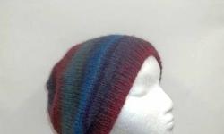 A very colorful slouch hat for men or women, medium size, wool and acrylic yarn, colors in this handmade beanie hat are teal, mauve, plum, purple, blue and a few more. Very colorful. Stretchy, will fit any head. The yarn is 53% wool and 47%