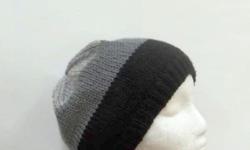A great beanie for winter. This knitted beanie hat looks great on both men and women. The colors are black, dark gray and light gray. Completely hand knitted. Very stretchy, will fit any adult head, stretches out to 31 inches around. Medium size. The