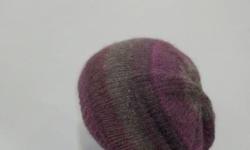 A soft comfortable beanie. Also suitable for teens or girls. The yarn used is a very soft wool blend and is sure to keep you warm! This handmade slouchy beanie has the colors of purple, lavender ,mauve, gray, grape, coral, it is knitted with a soft yarn
