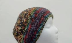 This beanie hat is a multi-color hand knitted hat. Very stretchy, will fit any head, stretches out to 31 inches around. Lots of color. Red purple,orange,bright green,blue just to name a few. Thick and warm beanie. Knitted with two strands of yarn. The