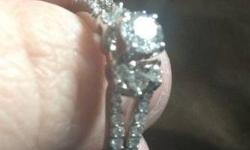 I'm selling this diamond engagement ring, I bought it at Littmans and it was worn once! It has a .50ct center stone and .50ct in stones surrounding it. It originally cost $3495 plus the warranty, I paid $2000 with the warranty. I am taking the best offer!