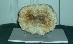 Citrine Geode-Origin Brazil Light yellow in color-rough front Size 4 1/2" High, 5 3/4" wide, and 2" thick. This specimen would make a nice add to your collection. Orignal price $100.00 to $65.00 Shipping $14.95 If interested please E mail. All payment