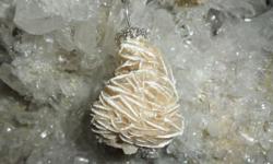 Beautiful Desert Rose Charm-Popular name for Rosette, like gypsum crystal found in desert areas. The edges of Selenite Rose are sharper and the crystalline structure is less hard than the barite rose. Popular name for Rosette, like gypsum aggregates,