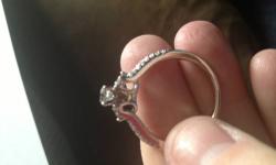I paid with tax and warranty over $2000, it was worn 1 time! It is 14k white gold and has 1ct of GORGEOUS diamonds! I bought the lifetime warranty (warranty includes breakage, loss of diamonds, AND sizing for life!, and you will get all paper work that