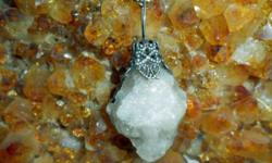 This is a Beautiful Fluorescent Grey and White Natural Moonstone Crystal Charm Antique Silver Crown hand Crafted by Paulsgems Creations and has an Exceptional Shine. This Crystal Charm would look Beautiful on around your neck on your gold or silver chain.