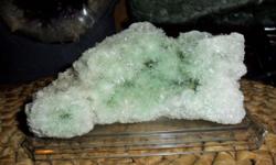 This is a Beautiful Full Cluster of Selenite Green Crystal Sprays and also a Geode on a Plastic base.. Origin: Australia. Selenite is a stone of mental clarity, enhancing mental flexibility and strengthening decisions. It is also a sweet Angel stone, for