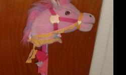 This is a Pink, Lavendar & Yellow Unicorn On a colorful pole. The Unicorn Horn Lights Up, and the Unicorn Speaks, Sings, and her mouth moves. This Unicorn is in great condition. She is activated by pressing on her ears. She takes 3 double AA batteries. If