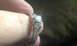 I paid with tax and warranty over $2000, it was worn 1 time! It is 14k white gold and has 1ct of GORGEOUS diamonds! I bought the lifetime warranty (warranty includes breakage, loss of diamonds, AND sizing for life!, and you will get all paper work that