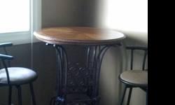 I am selling a beautiful wine table. The top is solid wood and the bottom is wrought iron. You can store several bottles of wine underneath the table. It is very heavy and was expensive but I just don'thave anywhere to put it in my new house. I am hoping