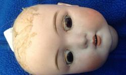 Beautiful bebe doll head. - rocker intact - head broken in rear neck area - no eye lashes - full upper inset teeth - you are buying eyes and teeth you will receive complete head as pictured. Can be see between Syracuse and honeoye falls by appointment -