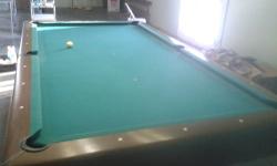 7ft bar size, non slate, with balls, rack, and 2 cue sticks. Inside the rails playing surface measures 6' x 3'. Same as the ones at sears for about $290 plus tax.