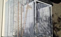 6 month old free standing cage expoxy coated (beige) 22X25 X35 of cage area.Floor cage with rollers wheels Cage is dismantled ready to go with top perch and stanless steel dishes. Cage wa $350.00
