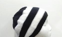 A great black and white stripe knitted beanie hat for men or women and teens. The stripes are 1 Â½ inches wide. Hand Knitted. Size medium. This beanie is a medium thickness, (not heavy) very stretchy, will fit any head, will stretch out to 31 inches