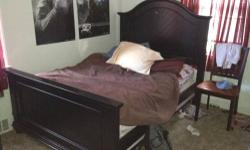 Black Full Size Bedroom set. Very good condition includes bed headboard footboard mattress, boxspring, Chest and night stand