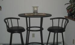 Relocating and need to downsize. Black Pub Table and 2 Swivel Chairs. Table is 41" high & 28" in diameter. The 2 swivel bar stools are 29" high. They have a padded seat. See pics. Rarely used; in good condition. $150 or best offer. Face to face, cash